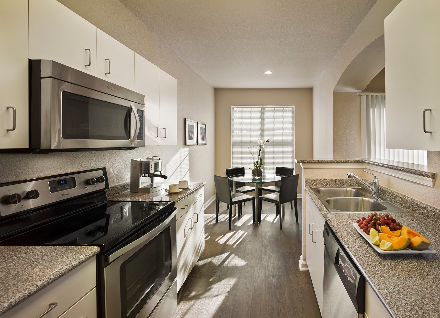 AVE Somerset furnished apartment kitchen with warm colors and accessories