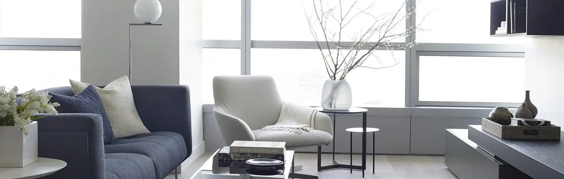 AKA University City cozy living room in neutral tones with high finishes