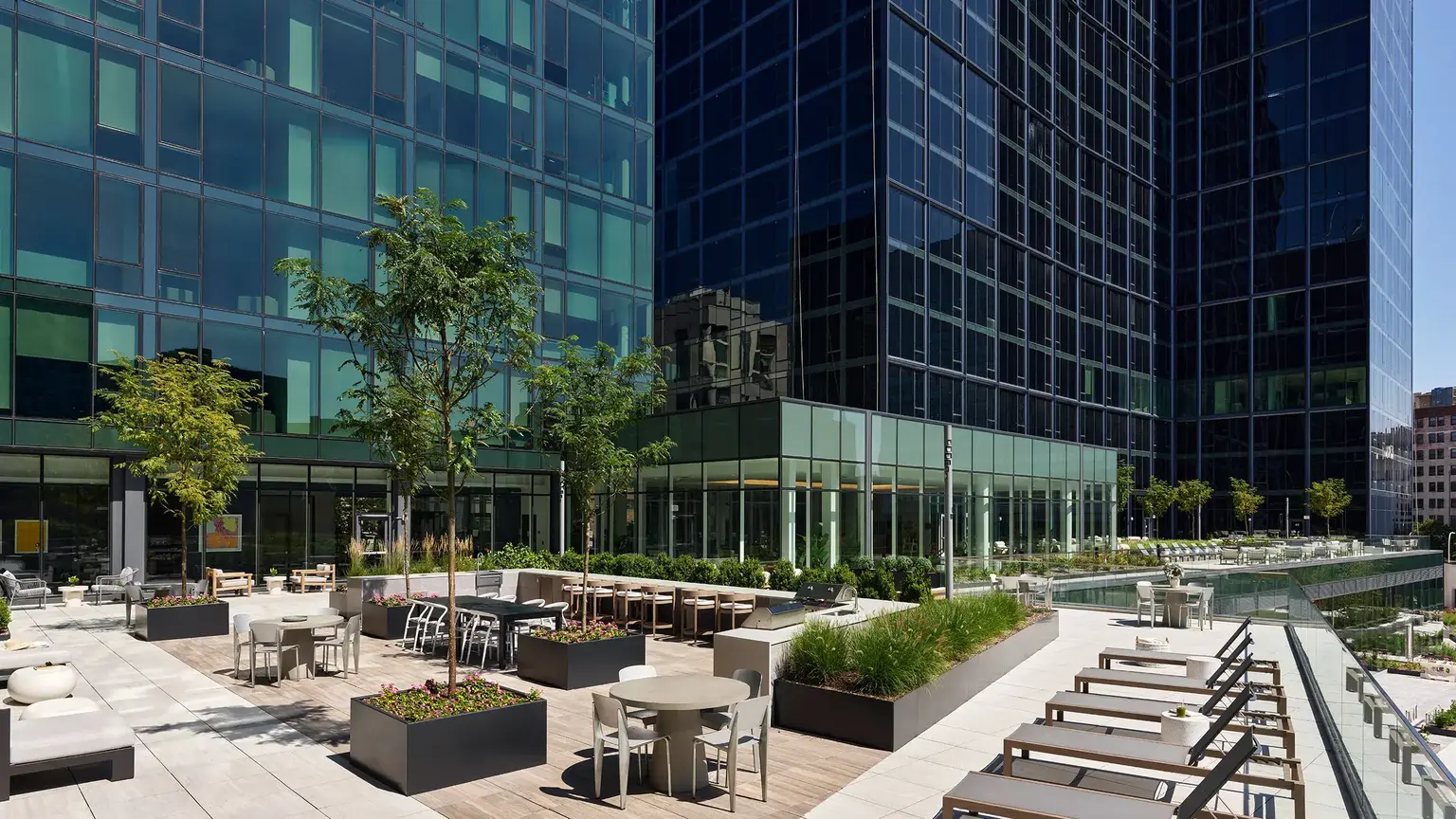modern outdoor terrace with outdoor furniture, greenery at AVE Hamilton Green