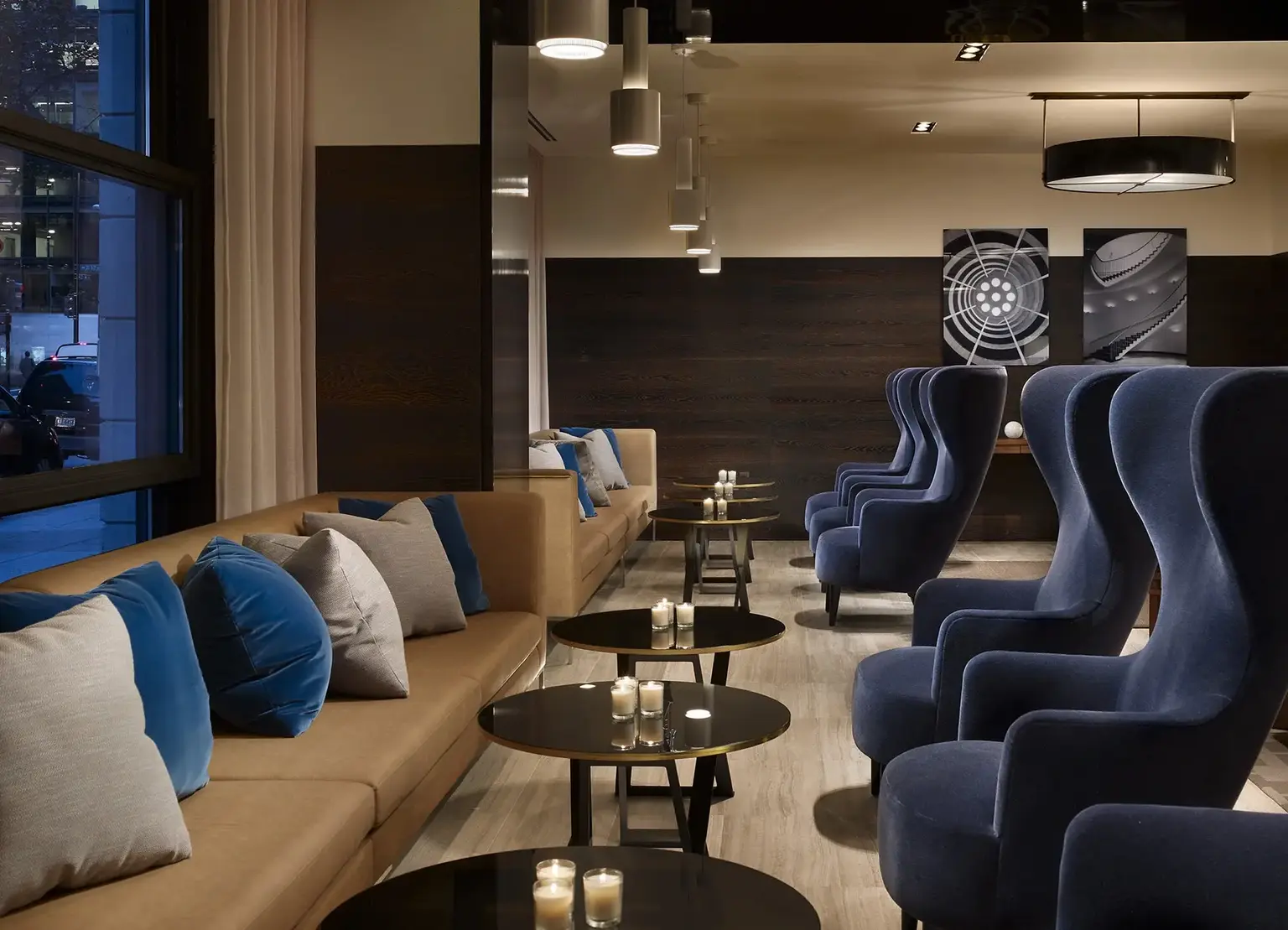 AKA White House lobby with small tables and large comfortable blue chairs with street view of Philadelphia 