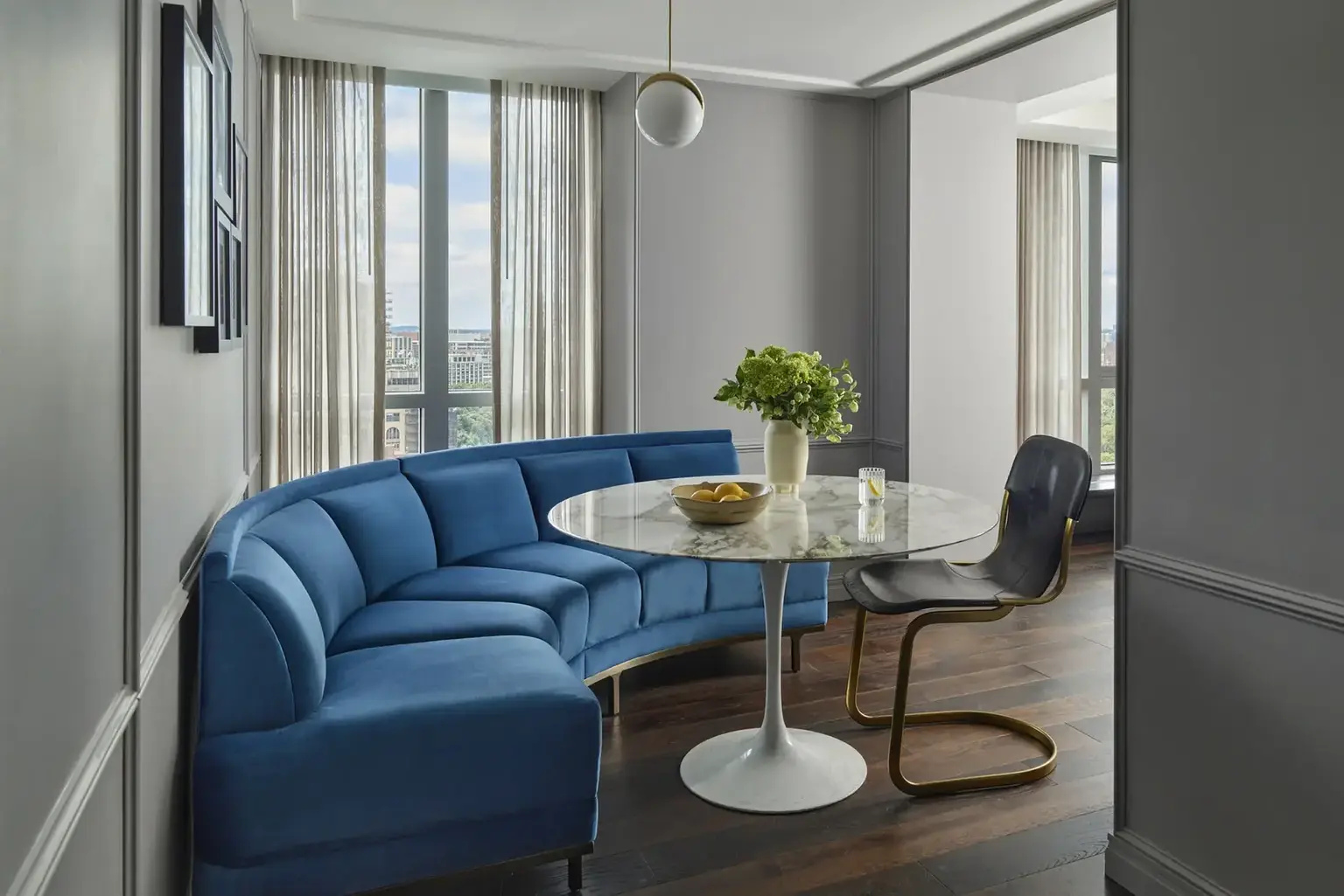 Boston Common hotel room with large window and an old fashion telescope