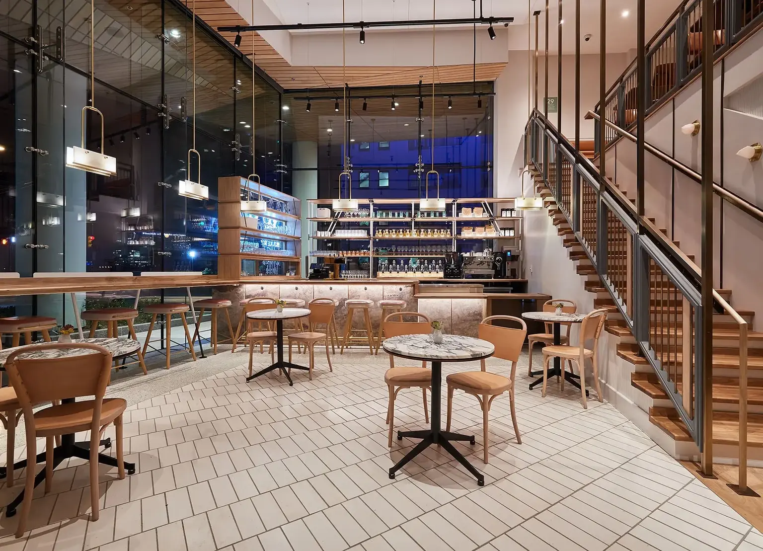 Walnut Street Cafe with coffee counter and bistro tables at AKA University City
