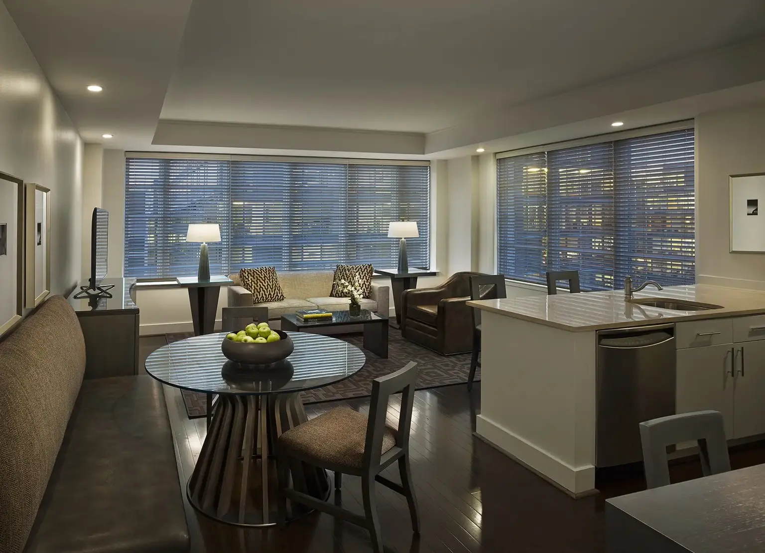 AKA White House apartment living room with kitchen island visible