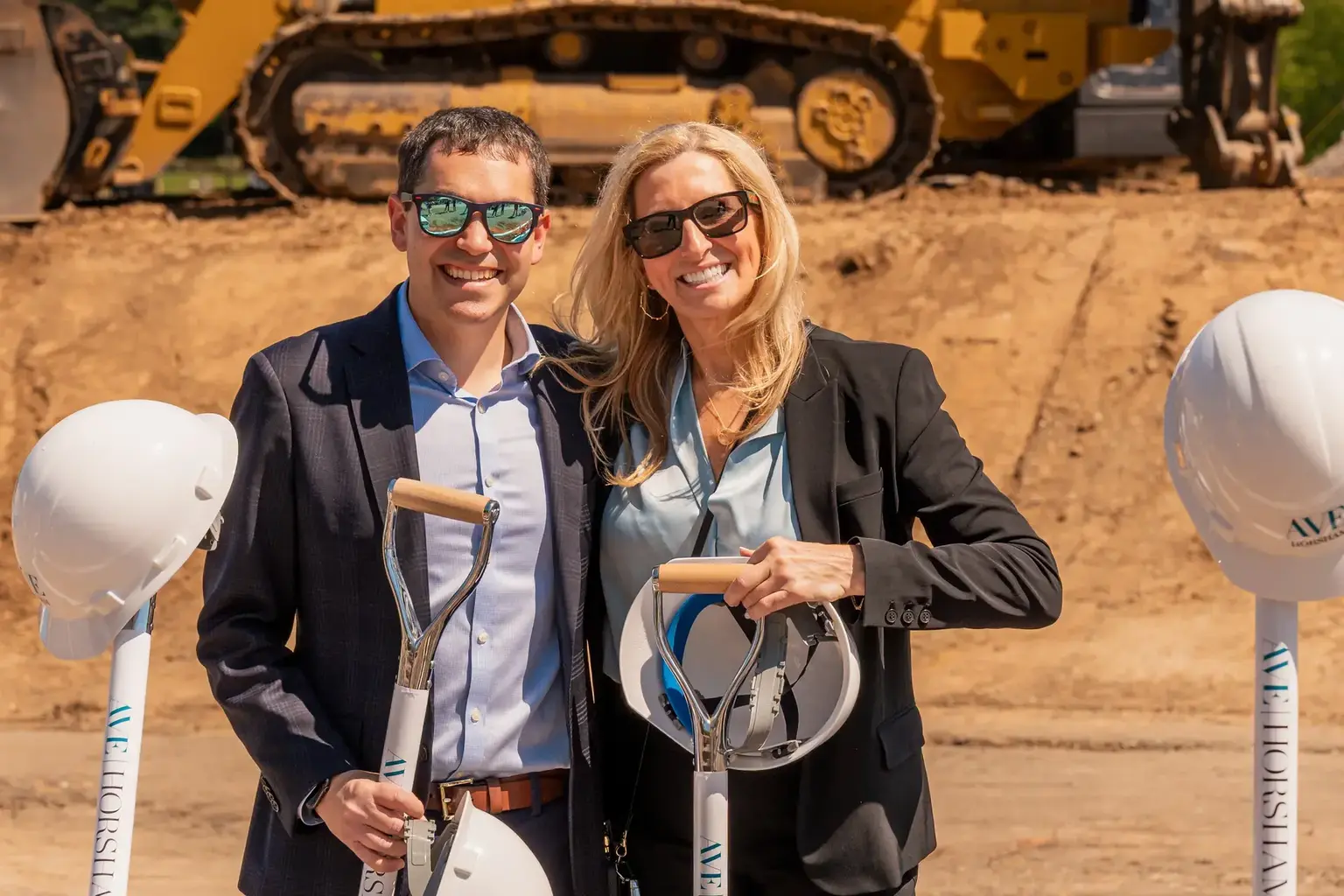 Participants posing with ceremonial shovels at the AVE Horsham groundbreaking event