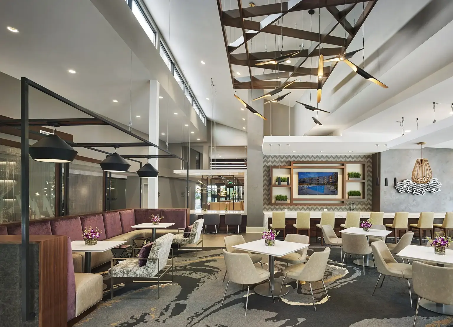 AVE King of Prussia cafe with dark marble accents and bistro tables