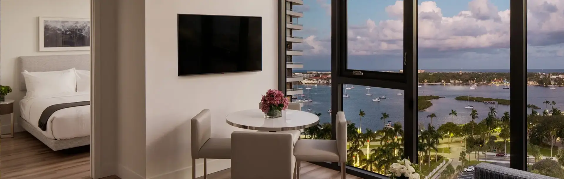 AKA West Palm apartment with large floor to ceiling window overlooking the bay