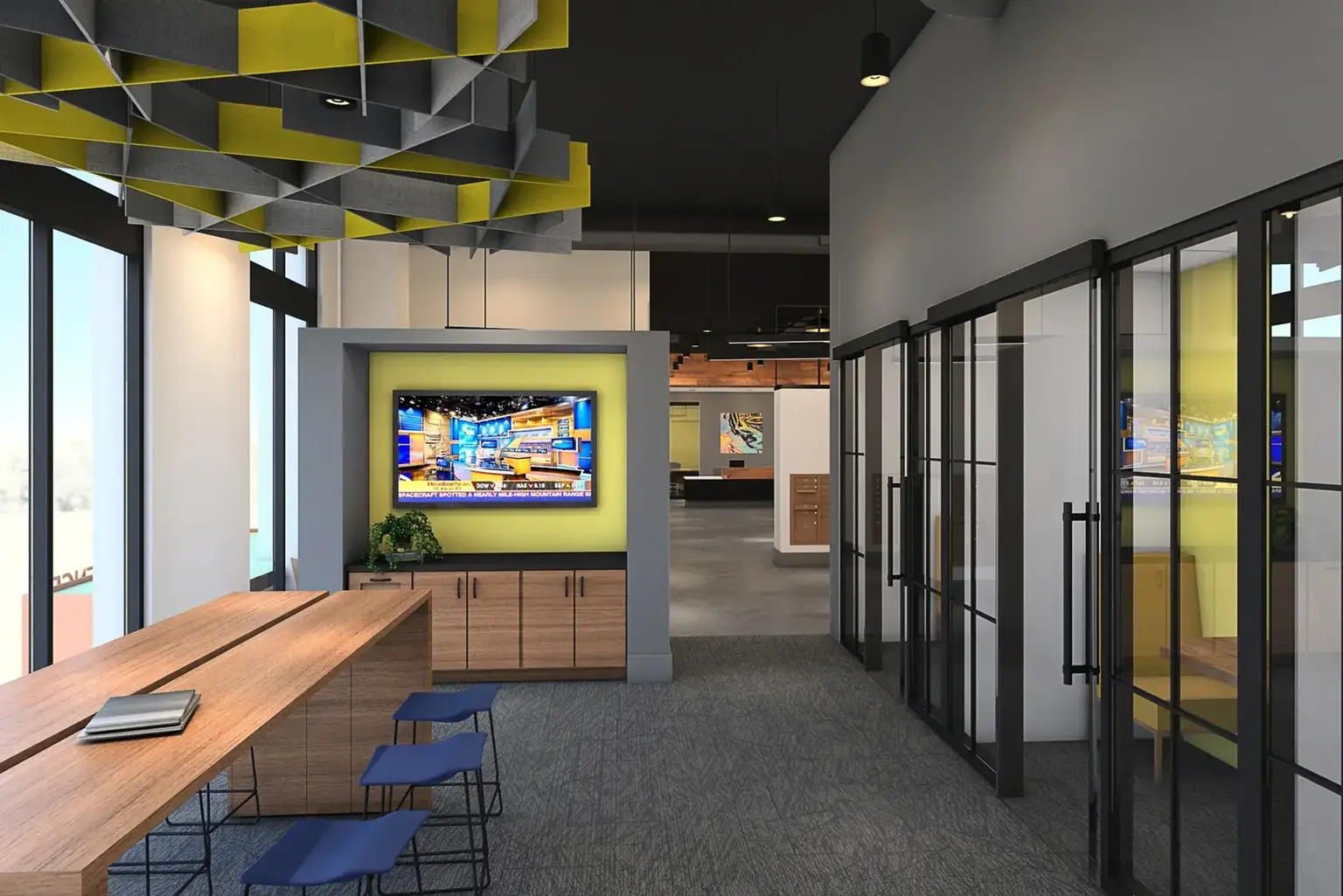 A rendering of a business center at AVE Navy Yard Constitution property with desks, tv screens, sliding glass doors