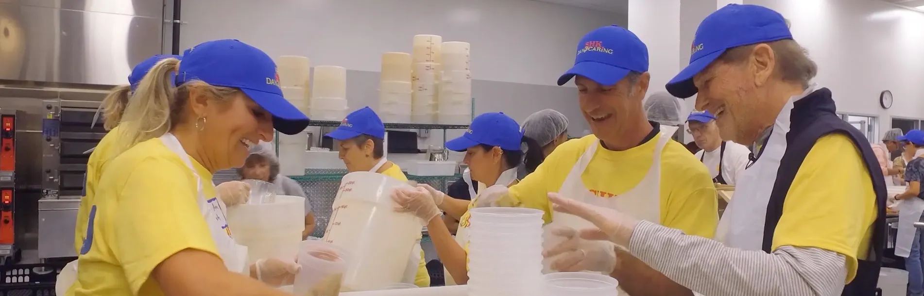 MANNA - Lean Anne Walsh and Steve Korman packing food