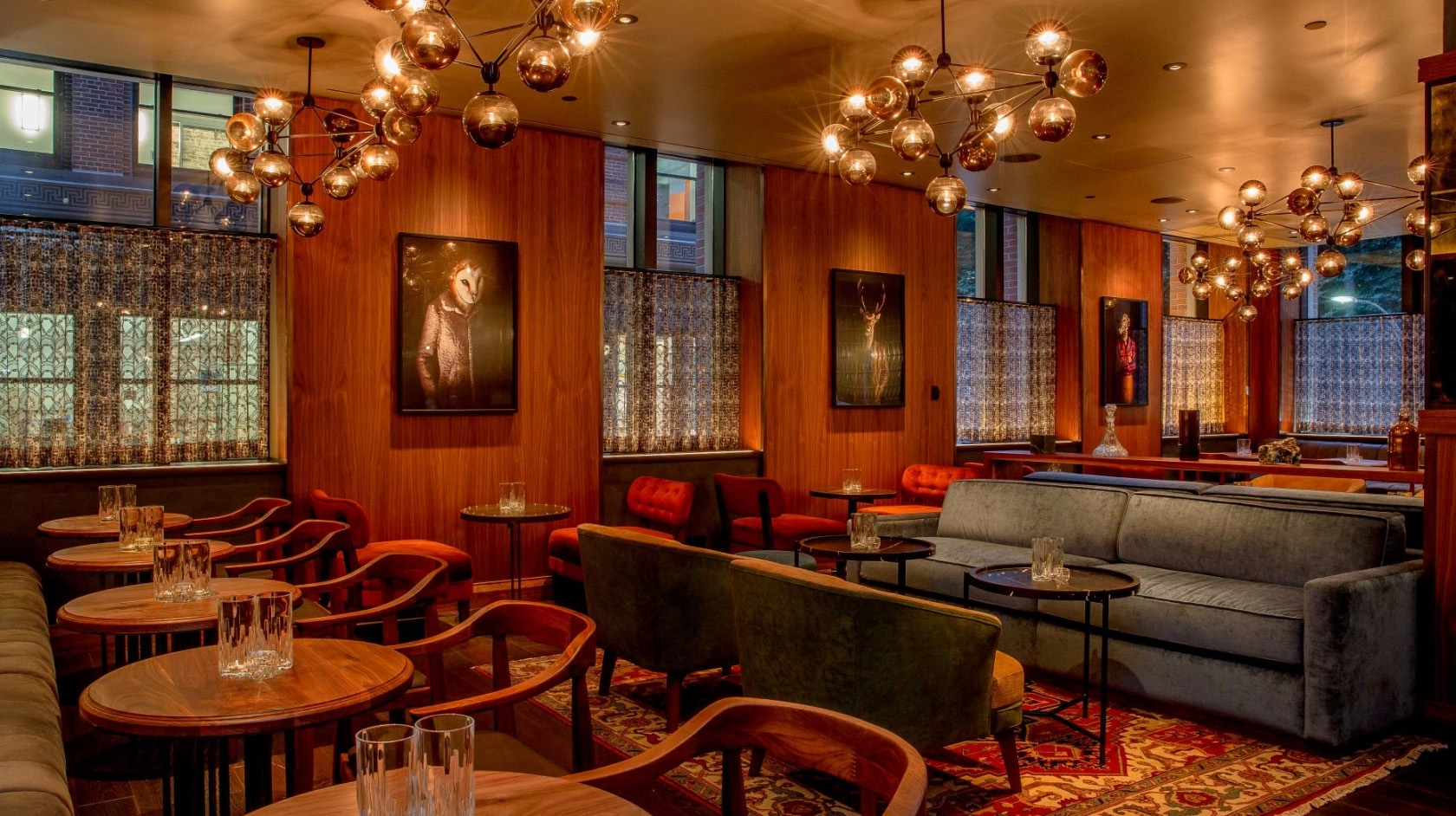 Boston Common atmospheric lounge with dim lighting and tufted furniture