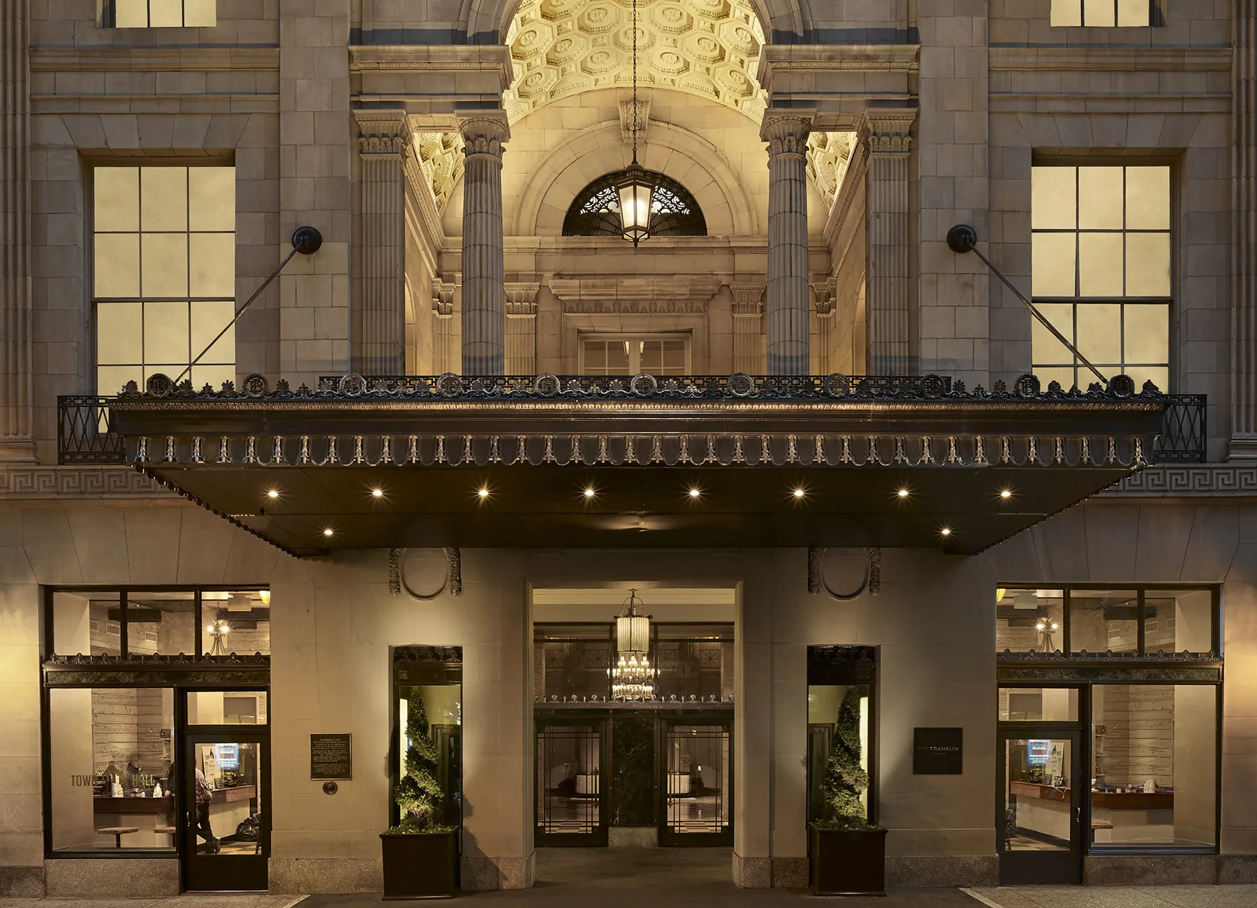 Ornate entrance to The Franklin Residences, a historic stone building in downtown Philadelphia