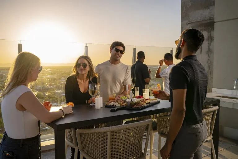 Young people socializing at a resident event in AVE Phoenix SKY